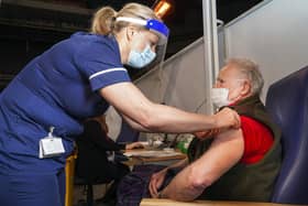 Sally Conlan Deputy Nurse Director for the Covid 19 Vaccination Programme vaccinates Colin Moss  at the Covid 19 max vaccination centre which has opened at the Sheffield Arena. Picture Scott Merrylees