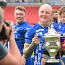 Dons' Tom Halliday celebrates promotion.