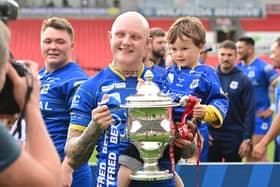 Dons' Tom Halliday celebrates promotion.