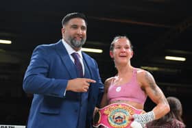Terri Harper celebrates her world title defence in her hometown, along with promoter Izzy Asif.