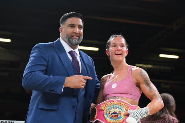 Terri Harper celebrates her world title defence in her hometown, along with promoter Izzy Asif.