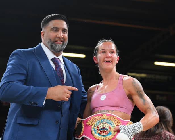Terri Harper celebrates her world title defence in her hometown, along with promoter Izzy Asif.