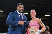 Terri Harper celebrates her world title defence in her hometown, along with promoter Izzy Asif.