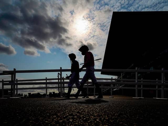 Jockeys make their way to the parade ring during last month's St Leger Festival at Doncaster Racecourse. Photo by Alan Crowhurst/Getty Images