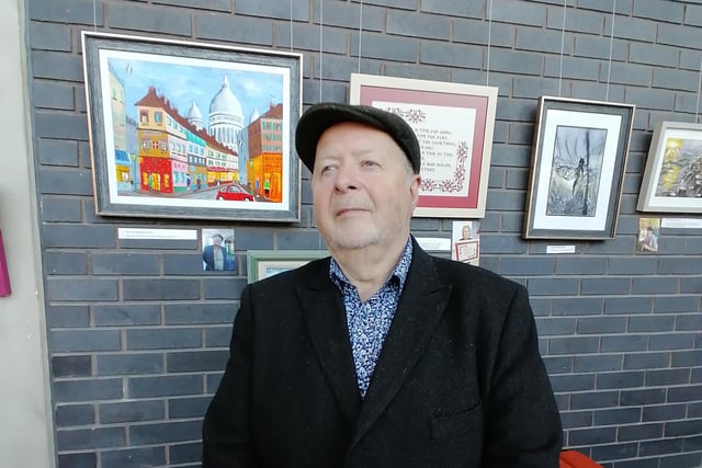 Paul in front of some of the artwork