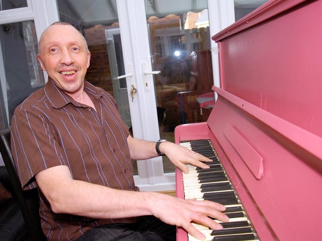 Ian Coley, director of the Doncaster Amateur Operatic society, with the pink piano back in 2011