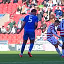 Max Woltman has a shot at goal against Leyton Orient.
