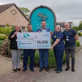 One Call Customer Service Manager Emma Marr (left) and CEO Nik Springthorpe (centre) are pictured with staff from St John’s Hospice in Balby.