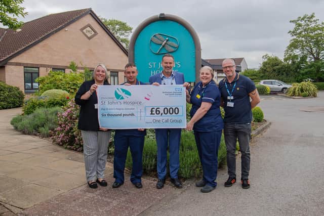 One Call Customer Service Manager Emma Marr (left) and CEO Nik Springthorpe (centre) are pictured with staff from St John’s Hospice in Balby.