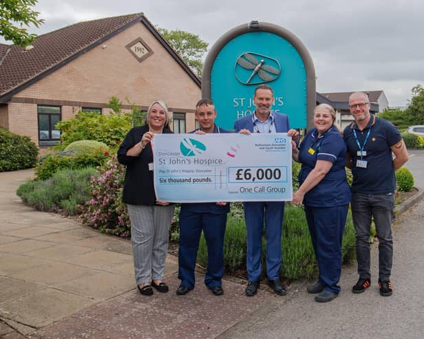 One Call Customer Service Manager Emma Marr (left) and CEO Nik Springthorpe (centre) are pictured with staff from St John’s Hospice in Balby.