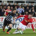 Wayne Rooney of Manchester United in action with Mike Williamson of Newcastle United during the Barclays Premier League match between Newcastle United and Manchester United at St James' Park on March 4, 2015 in Newcastle upon Tyne, England.  (Photo by Matthew Peters/Manchester United via Getty Images)