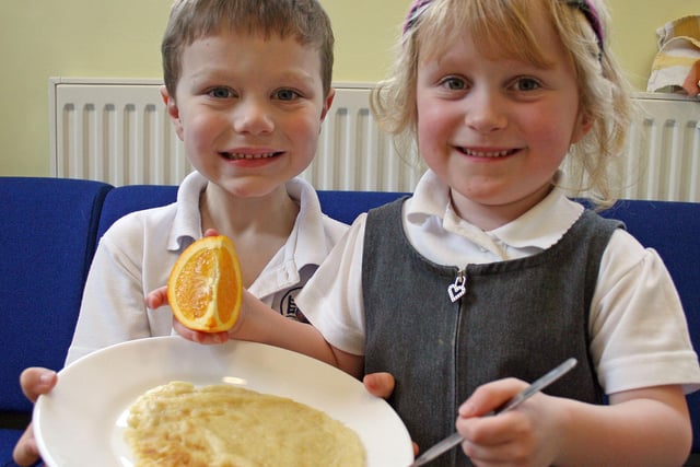 Callum Briggs and Eva Gardiner, both five, at Ambergate Primary School's pancake day in 2009.