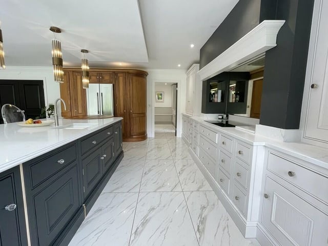 Ample storage and workspace in the immaculate kitchen space.