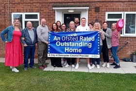 Children's home staff celebrate Ofsted success.