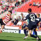 Chris Brown volleys on goal