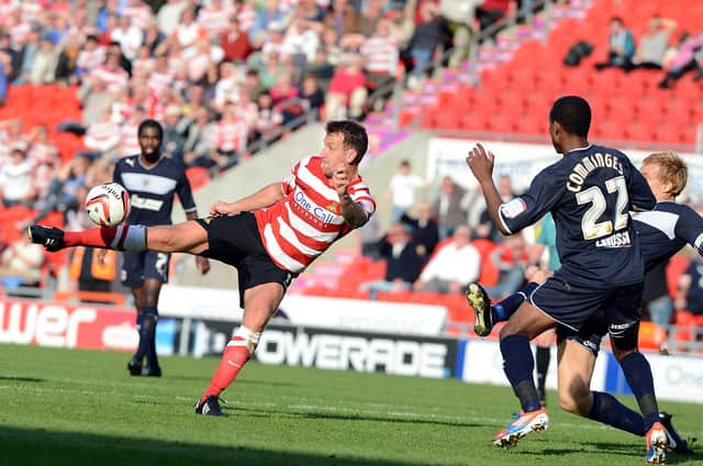 Chris Brown volleys on goal