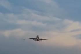 The mystery object can be seen flying past the plane at high speed.