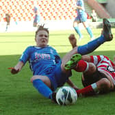 Millie Bright gets in a sliding tackle against Birmingham in her Belles days.  Picture: Malcolm Billingham