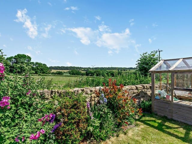 Stunning countryside stretches out beyond the rear garden.