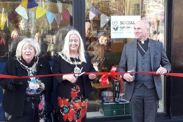 Cutting the ribbon at the opening of the Social Supermarket are the Mayor of Rotherham (centre) Jenny Andrews, the Mayoress Jeanette Mallinder and the Bishop of Sheffield the Rt Rev Peter Wilcox