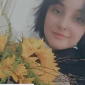 Jessica with her celebration bouquet of sunflowers after getting her GCSE results.