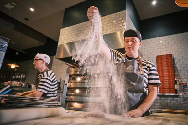 See the pizzas made fresh.