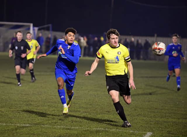 Rossington's Myron Gibbons chases a long ball during their defeat to Worksop Town. Picture: Marie Caley