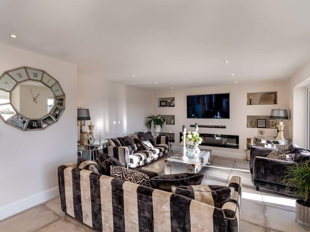 This large reception room attracts plenty of natural light, while displaying open views.