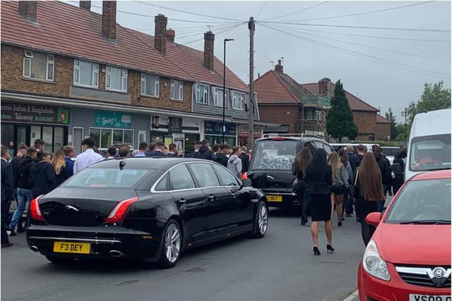 Friends and family walked Owen's coffin off Clay Lane.