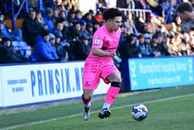 Charlie Seaman takes on a Tranmere defender in the reverse fixture on Boxing Day.