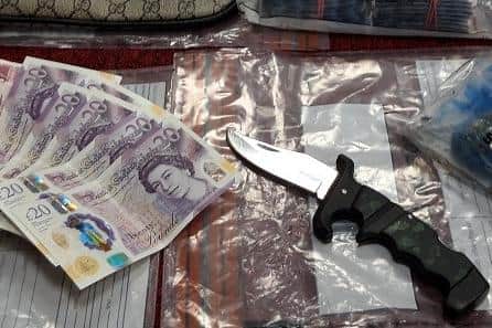 Police seized drugs, cash and potentially deadly weapons