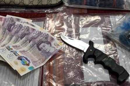 Police seized drugs, cash and potentially deadly weapons