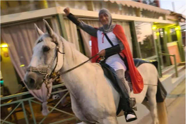 England fan Terry Hill, who dubs himself Donny Knight, rode through the streets of Corfu on horseback.