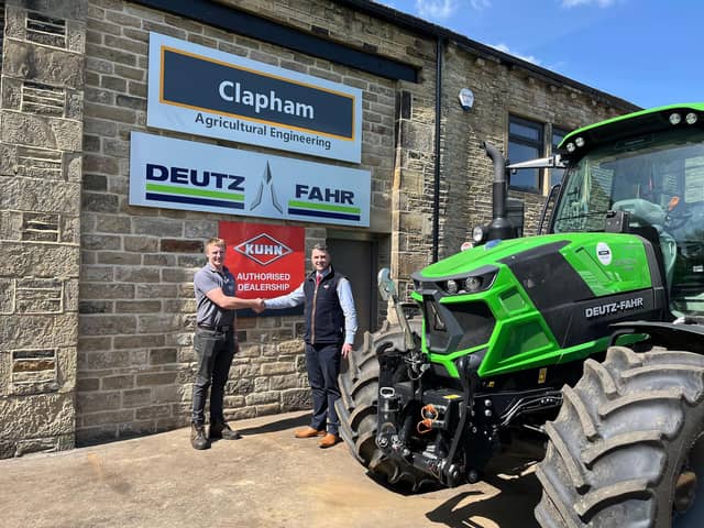 (L/R) Ed Clapham, Clapham Agricultural, and Karl Ridsdale, Area Sales Manager for Northern England at KUHN, agree the new partnership.