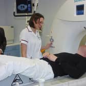 Doncaster Round Table charity officer Pascal Davis is given a demonstration of the Scanner which him and his members helped to provide, by superintendant radiographer Sarah Gibson. Picture: Liz Mockler D1839LM