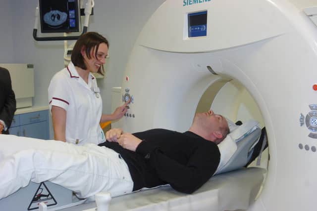 Doncaster Round Table charity officer Pascal Davis is given a demonstration of the Scanner which him and his members helped to provide, by superintendant radiographer Sarah Gibson. Picture: Liz Mockler D1839LM