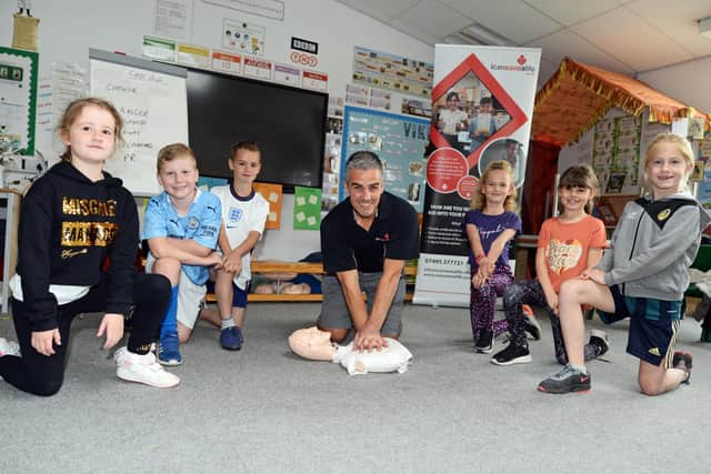 Sam Clark, of I Can Save A Life, pictured with (l-r) Ellie Major, George Wilkey, Leo Sabir, Libby Browning, Molly Clark and Isabelle Taylor during a first aid session at Carr Lodge Academy in Balby