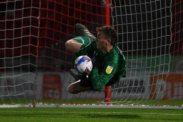 Louis Jones saves a penalty in the shootout against Bradford City