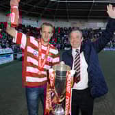 Brian Flynn, with James Coppinger, after winning the League One title