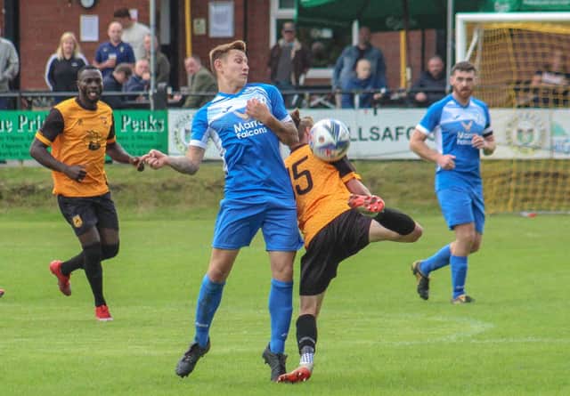 Action from Armthorpe Welfare's FA Vase clash at New Mills. Photo: Steve Pennock