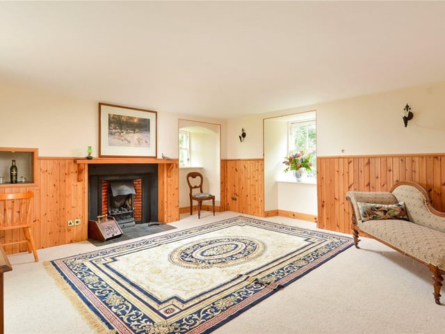 On the first floor is a further sitting room, which has an electric fire and views over the property's grounds.
