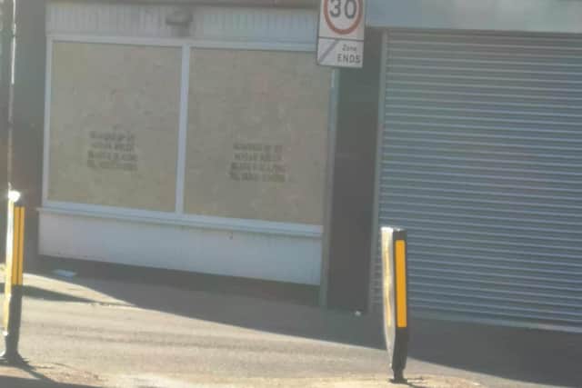 Businesses have been boarded up following the attacks.