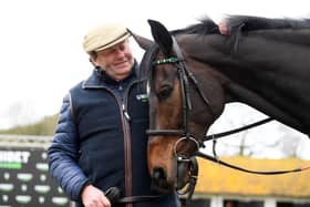 Trainer Nicky Henderson poses for a photo with Altior. Photo: Alex Davidson/Getty Images