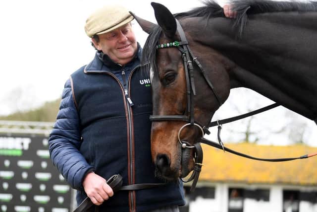 Trainer Nicky Henderson poses for a photo with Altior. Photo: Alex Davidson/Getty Images