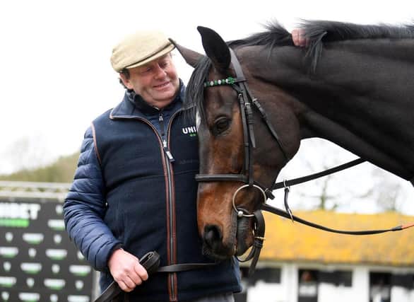 Trainer Nicky Henderson poses for a photo with Altior. Photo: Alex Davidson/Getty Images
