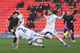 Aidan Barlow tries his luck on goal against Wigan. Picture: Howard Roe/AHPIX LTD.