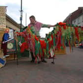 Mel Myland and Tony Nicholson entertain shoppers in Doncaster with their puppet show telling the tale of St George and the Dragon