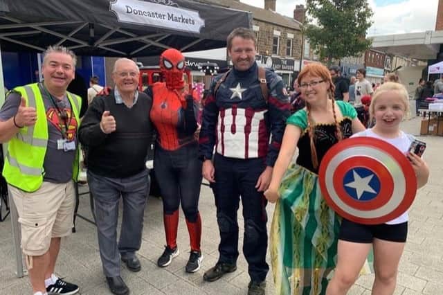 Coun Sean Gibbons with superheroes