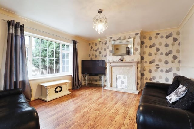 The lounge has a feature fireplace to the chimney breast.