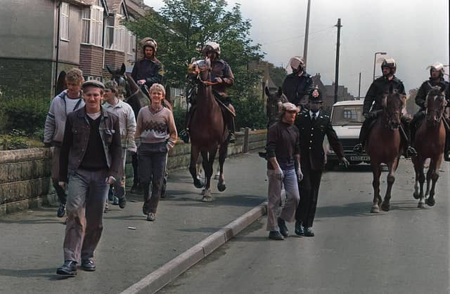 Striking miners are coralled by police on a Doncaster street during the 1984-85 Miners' Strike.